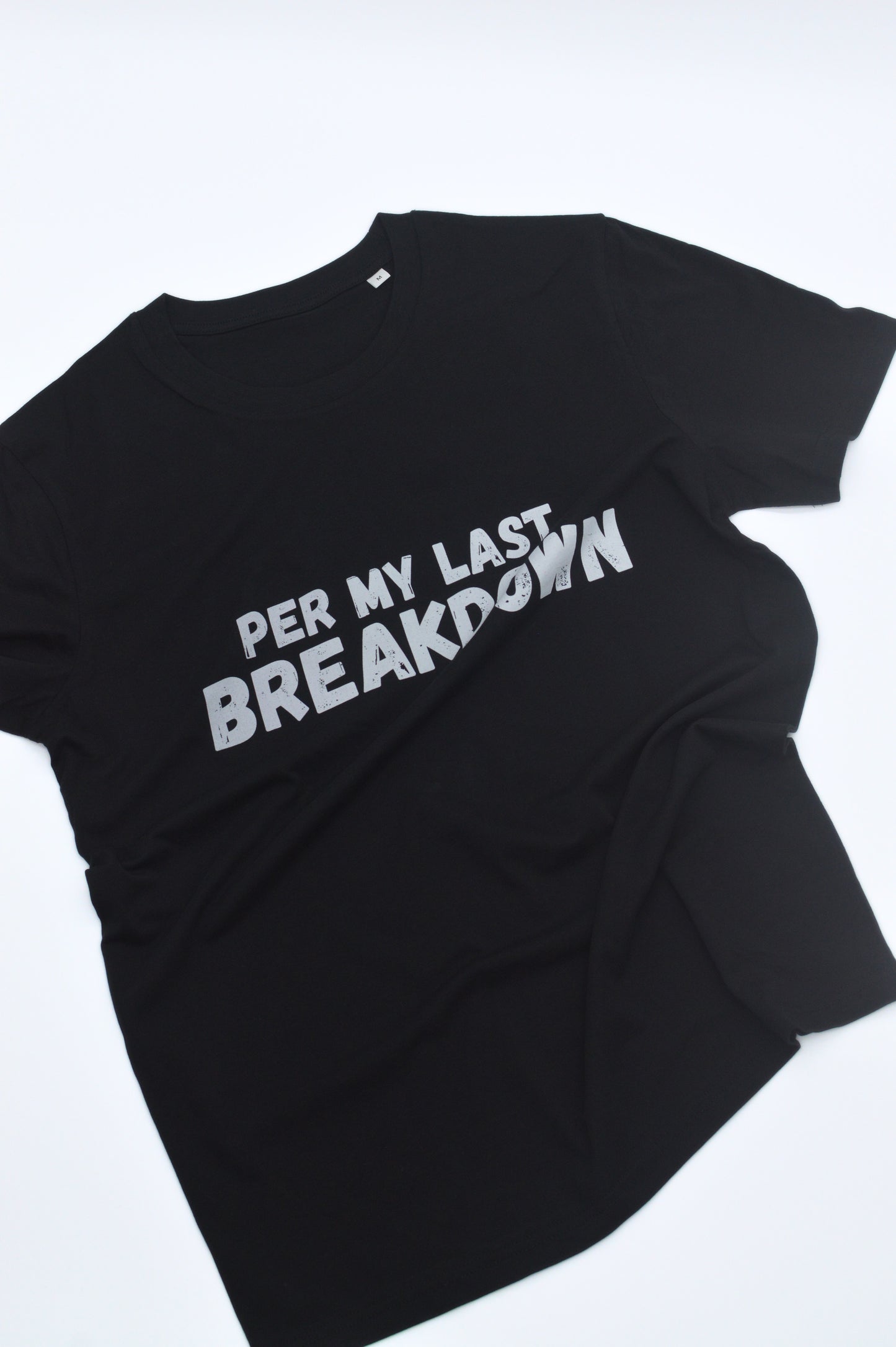 Black t-shirt with white text 'PER MY LAST BREAKDOWN' on a white background