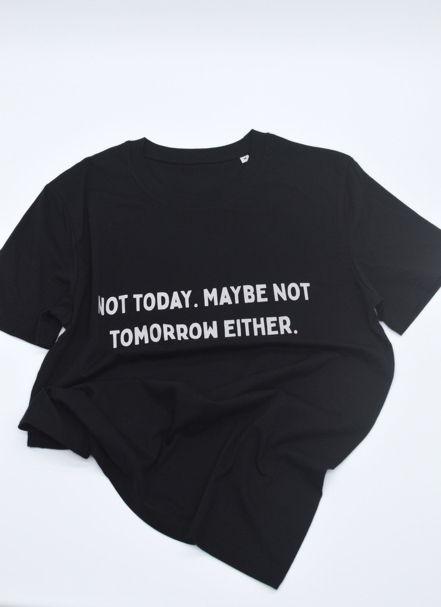 Black t-shirt with white text 'NOT TODAY. MAYBE NOT TOMORROW EITHER' on a white background
