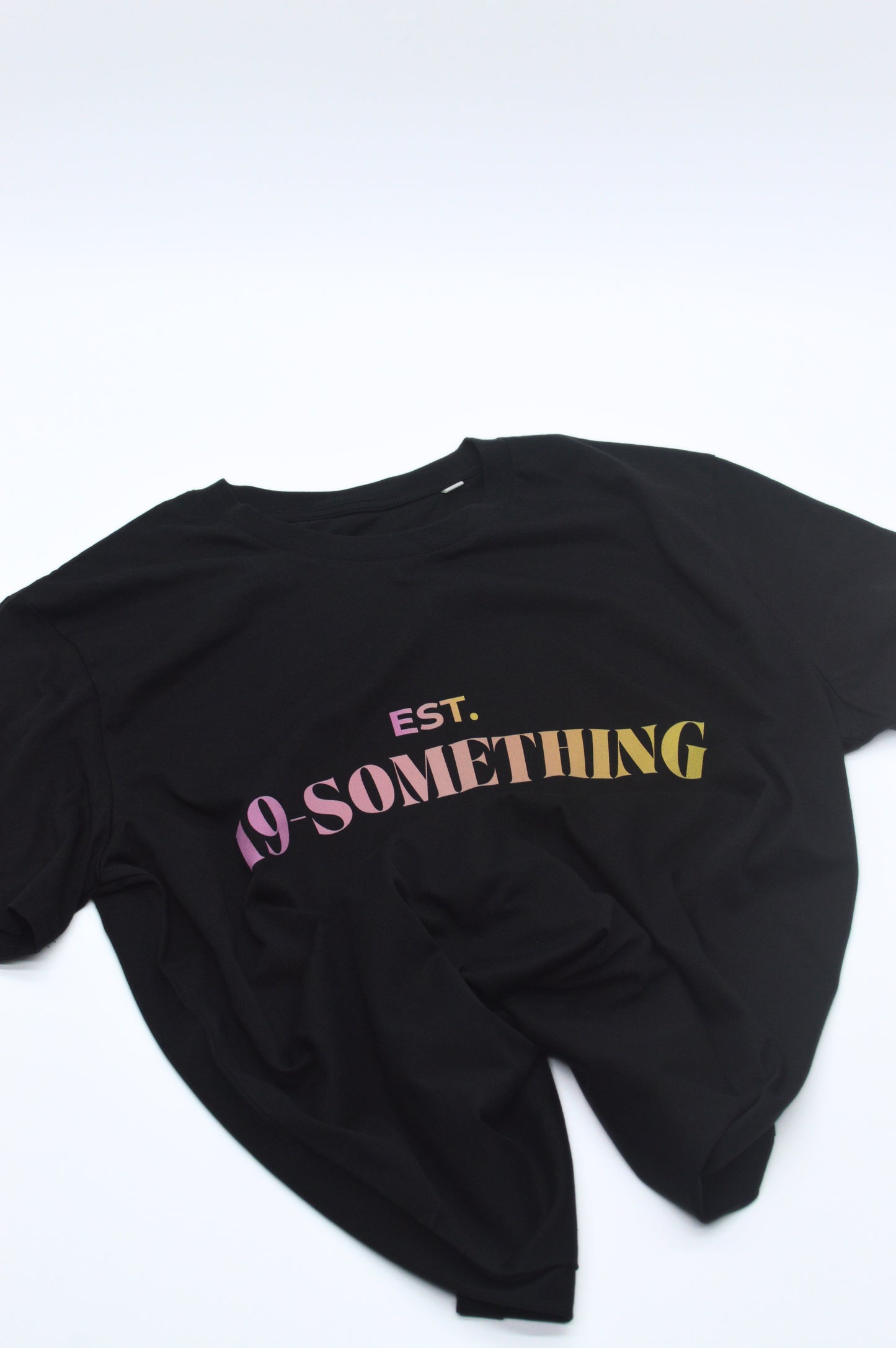 Black t-shirt with 'EST. 19 SOMETHING' text on a white background