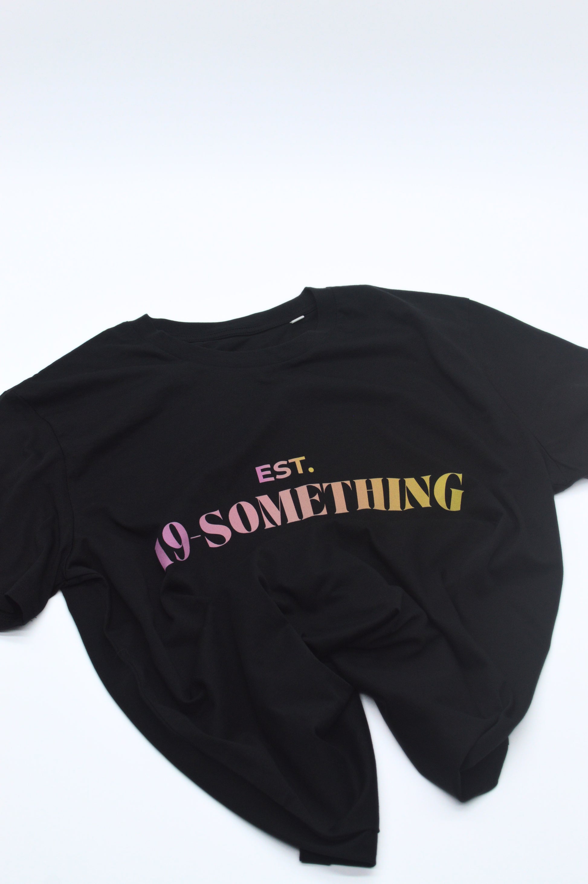 Black t-shirt with 'EST. 19 SOMETHING' text on a white background